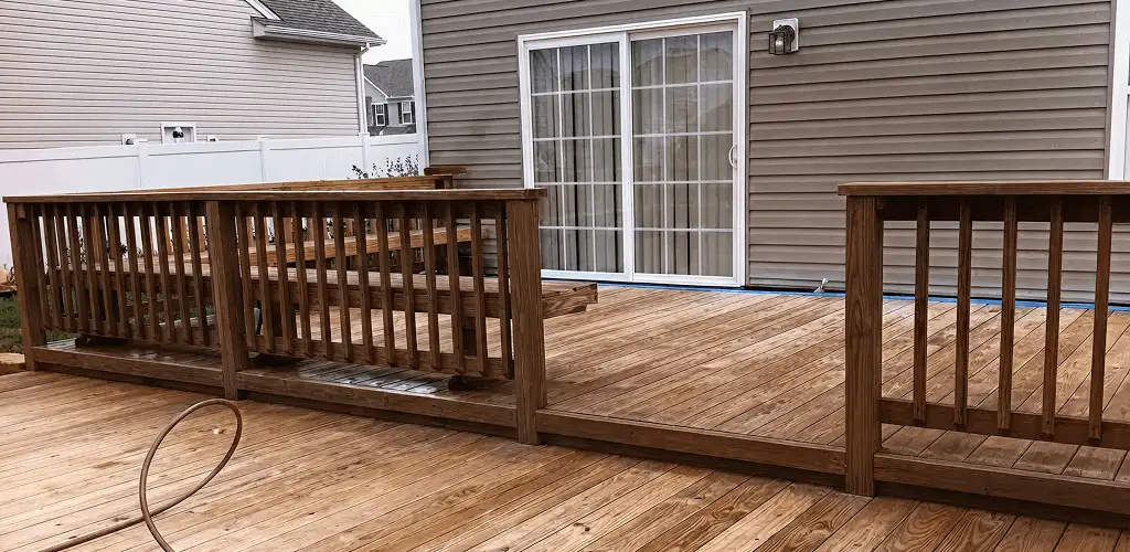 Deck sealing service protecting a backyard wood deck and railings in Anaheim, CA