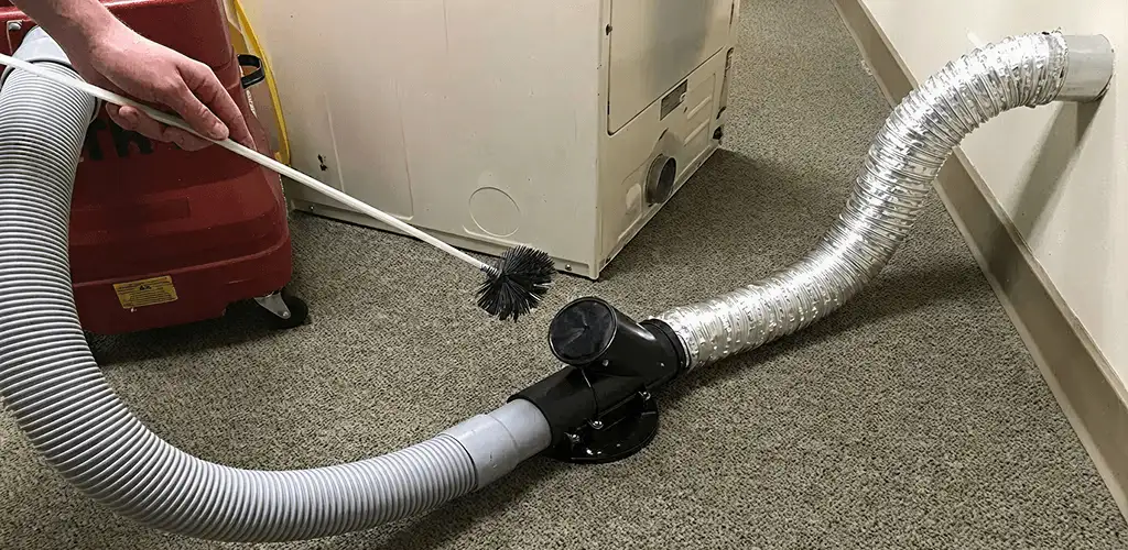 Dryer vent cleaning service removing lint from a dryer duct connection in Anaheim, CA