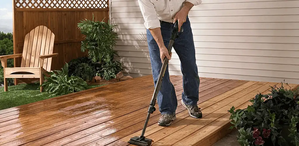 Deck staining service applying stain to a backyard wood deck in Anaheim, CA